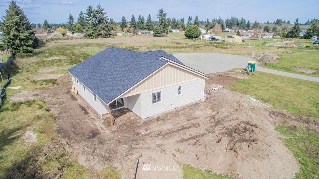 8420 183rd Avenue Southwest Rochester, WA 98579 - Photo 8 of 11 a view of a house with a yard