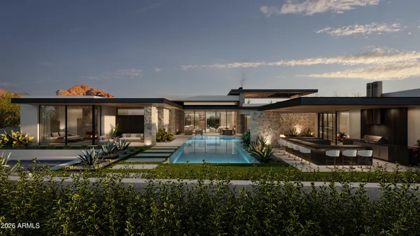a view of a house with backyard sitting area and garden
