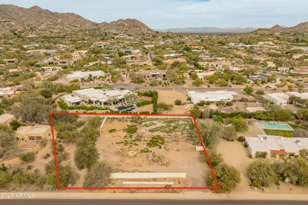 a view of residential houses with ocean view