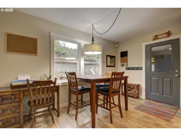 a view of a dining room with furniture window and outside view
