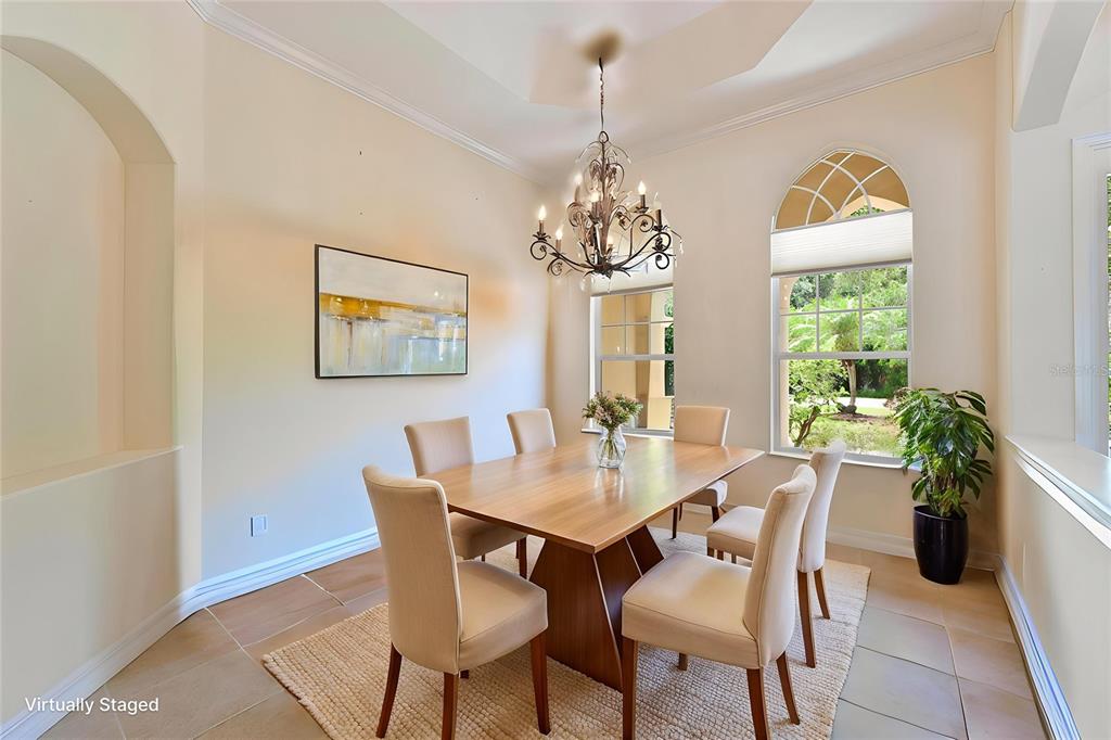 10622 Conch Shell Terrace Bradenton, FL 34212 - Photo 26 of 69 a view of a dining room with furniture window and outside view