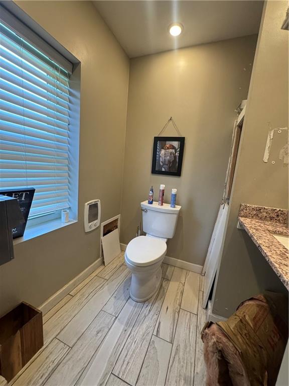 148 Big Knob Road Rochester, PA 15074 - Photo 13 of 16 a bathroom with a toilet a sink and mirror