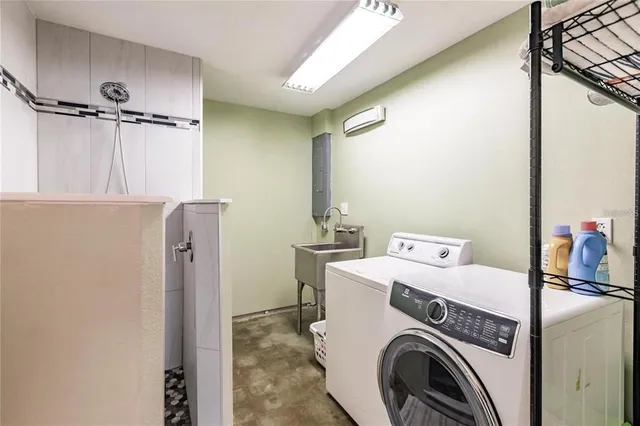 a utility room with dryer and washer