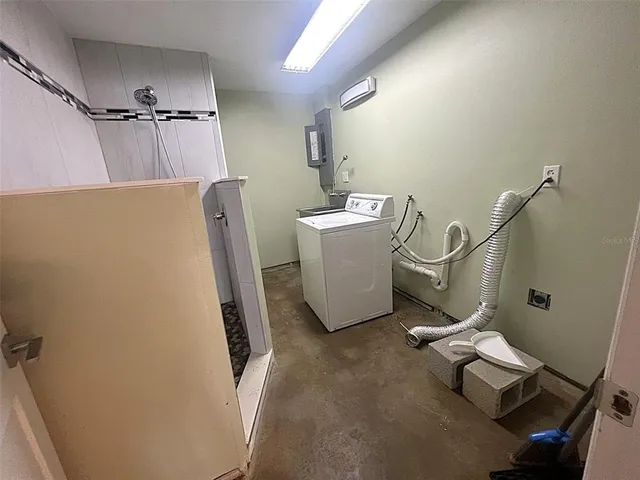 a utility room with dryer and washer
