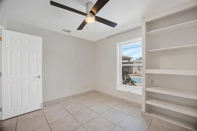 a kitchen with granite countertop a stove a sink and a granite counter top