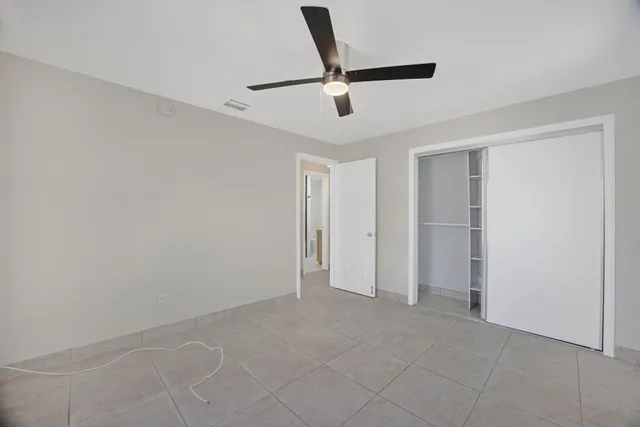 a close view of a refrigerator in kitchen and cabinets