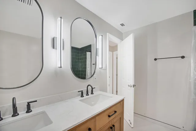 wooden floor in an empty room with a ceiling fan