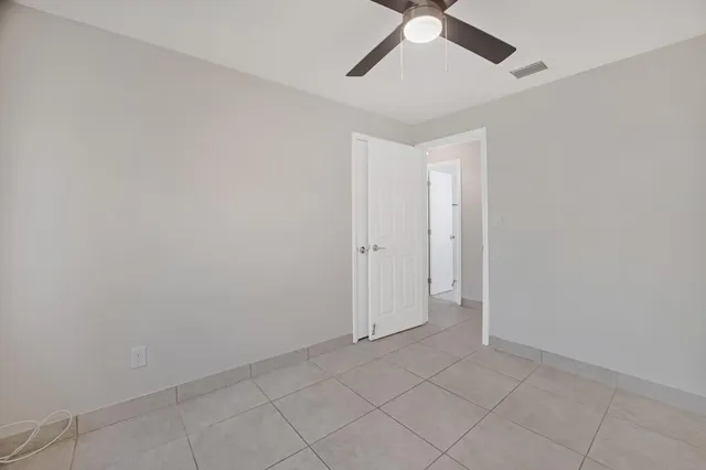 a view of a street with a building in the background