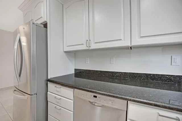 an aerial view of residential building with parking