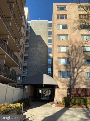 a front view of a building with a street