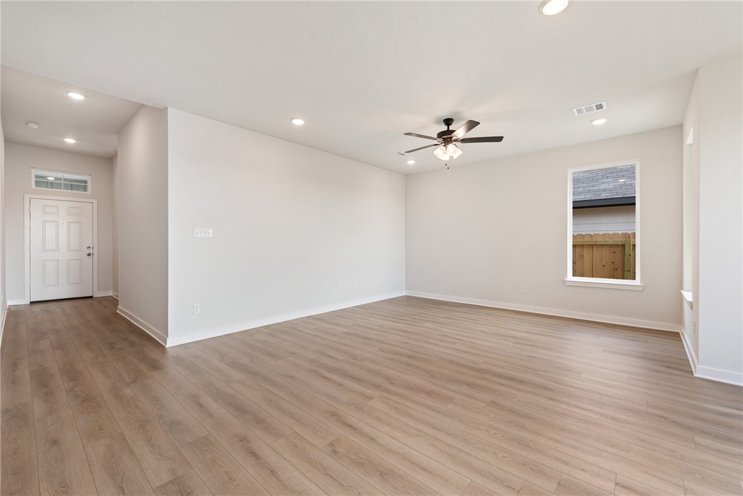 2415 Rooke Road Bryan, TX 77807 - Photo 23 of 36 a view of an empty room with a window and a kitchen
