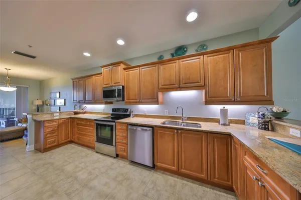 a kitchen with a sink cabinets and window