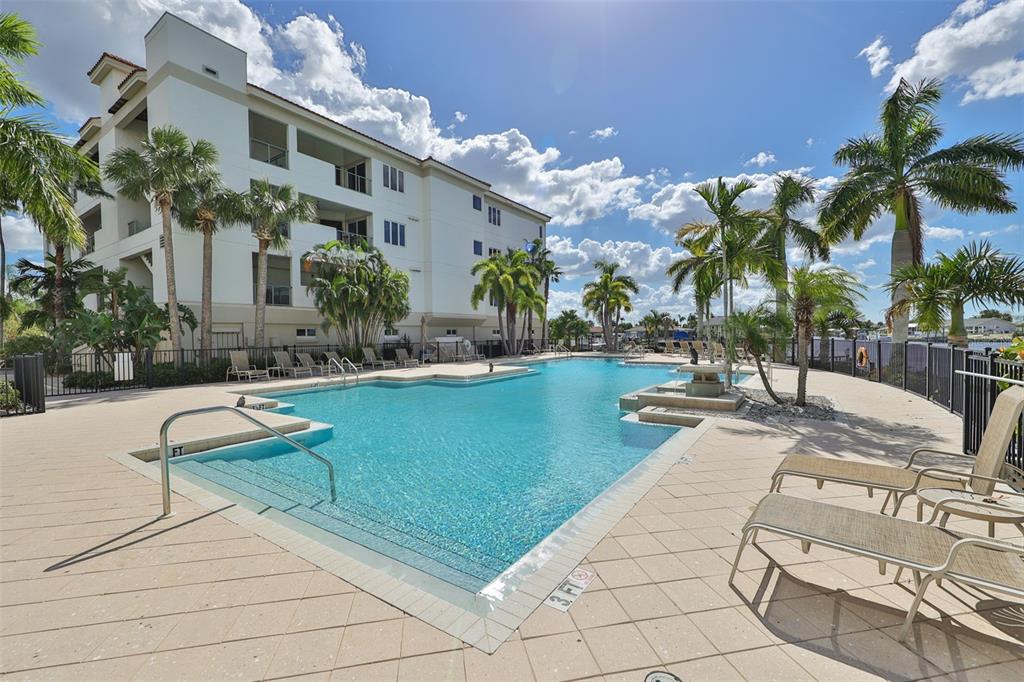 1030 Bellasol Way, Unit 302 Apollo Beach, FL 33572 - Photo 30 of 39 a view of swimming pool with outdoor seating and plants