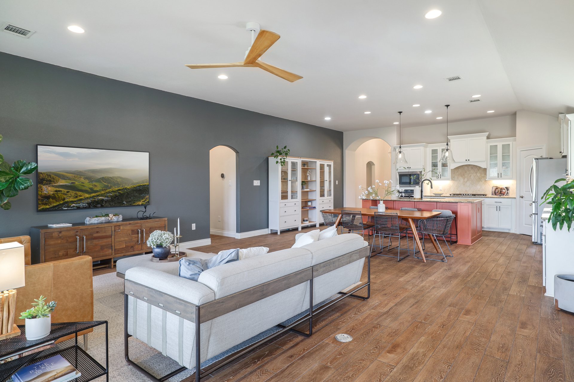 173 Santa Maria Street Georgetown, TX 78628 - Photo 14 of 39 Open-concept living space featuring wood-finish flooring, recessed lighting, and a modern ceiling fan