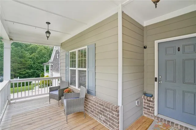 a view of a balcony with wooden floor