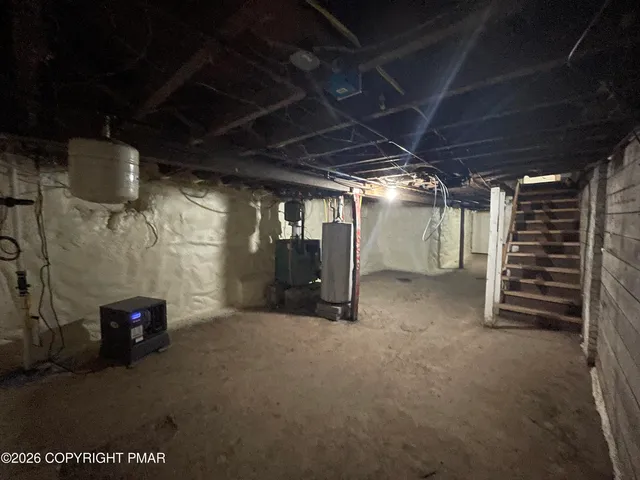 a view of empty room with wooden ceiling