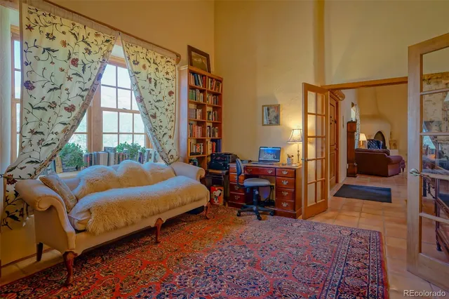 a bedroom with furniture and a window