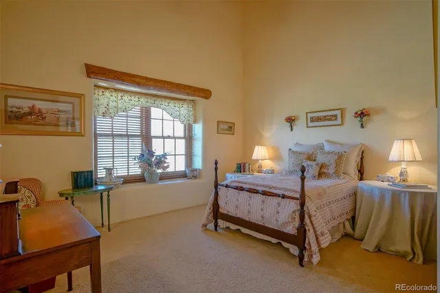 a bed room with a bed and a window