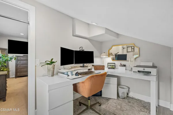 a view of a workspace with furniture