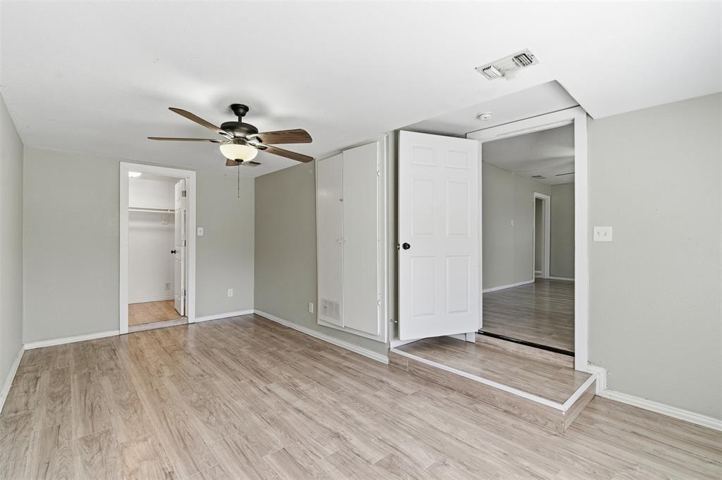 405 North Carr Avenue Sherman, TX 75090 - Photo 12 of 22 wooden floor in an empty room with a mirror