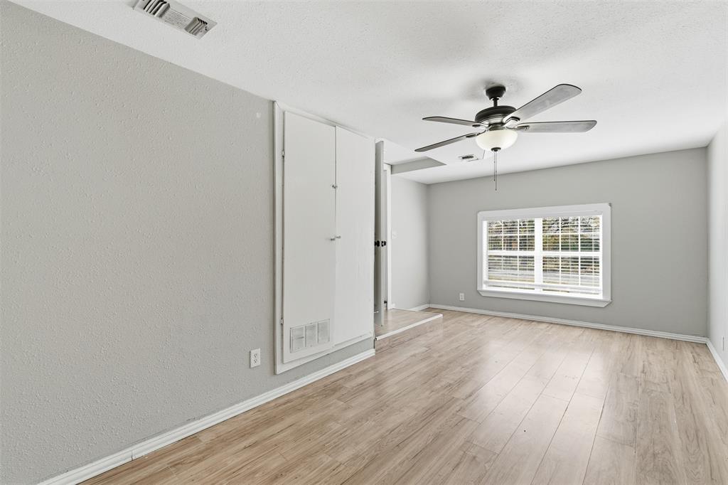 405 North Carr Avenue Sherman, TX 75090 - Photo 13 of 22 a view of an empty room with a window and wooden floor
