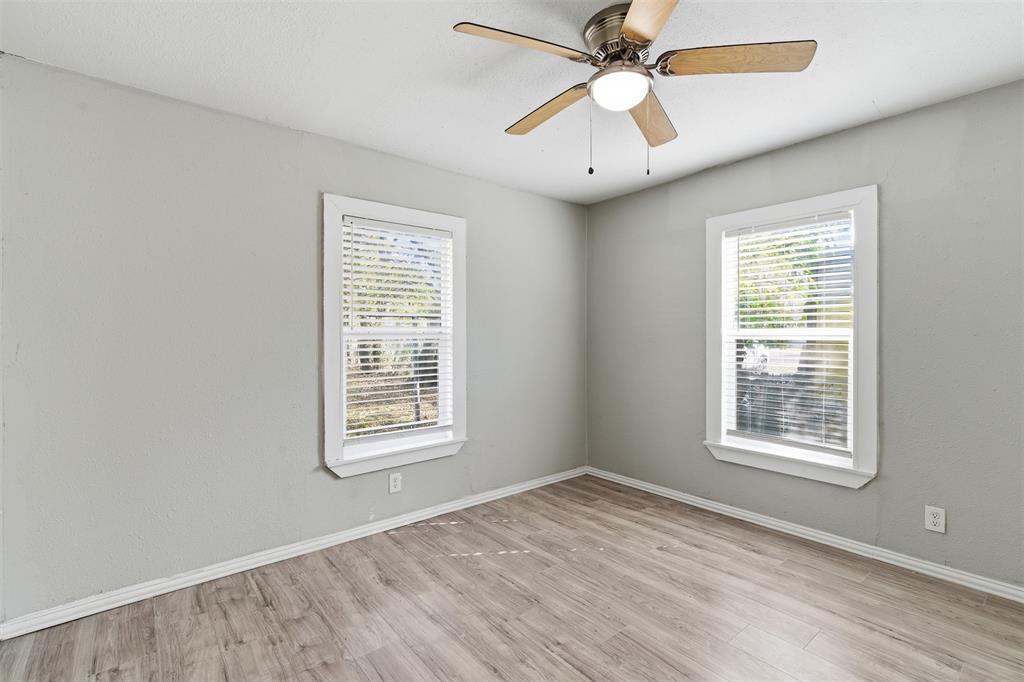 405 North Carr Avenue Sherman, TX 75090 - Photo 18 of 22 a view of an empty room with wooden floor and a window