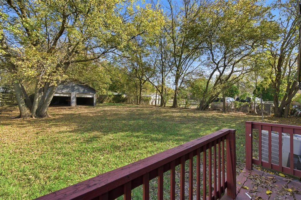 405 North Carr Avenue Sherman, TX 75090 - Photo 20 of 22 a front view of a house with a yard