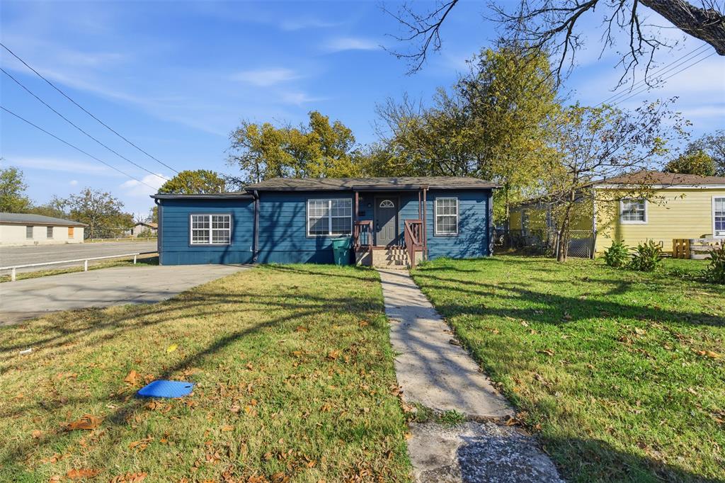 405 North Carr Avenue Sherman, TX 75090 - Photo 22 of 22 a front view of a house with a yard