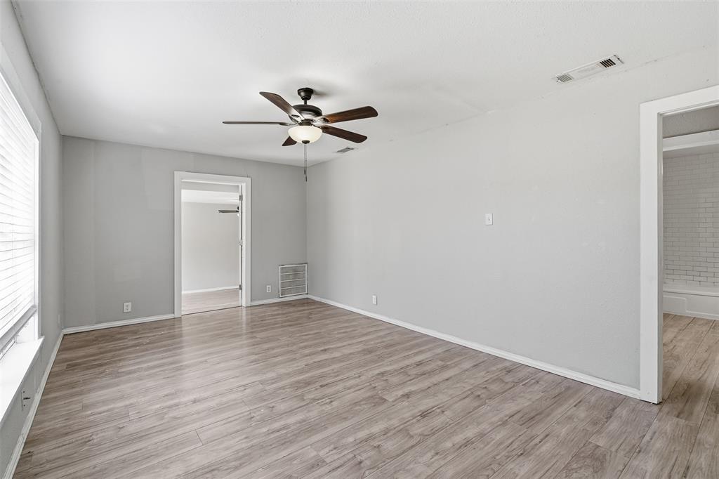 405 North Carr Avenue Sherman, TX 75090 - Photo 7 of 22 a view of empty room with wooden floor and fan