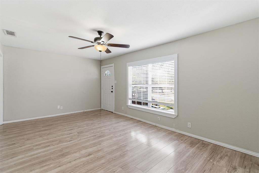 405 North Carr Avenue Sherman, TX 75090 - Photo 9 of 22 wooden floor in an empty room with a window