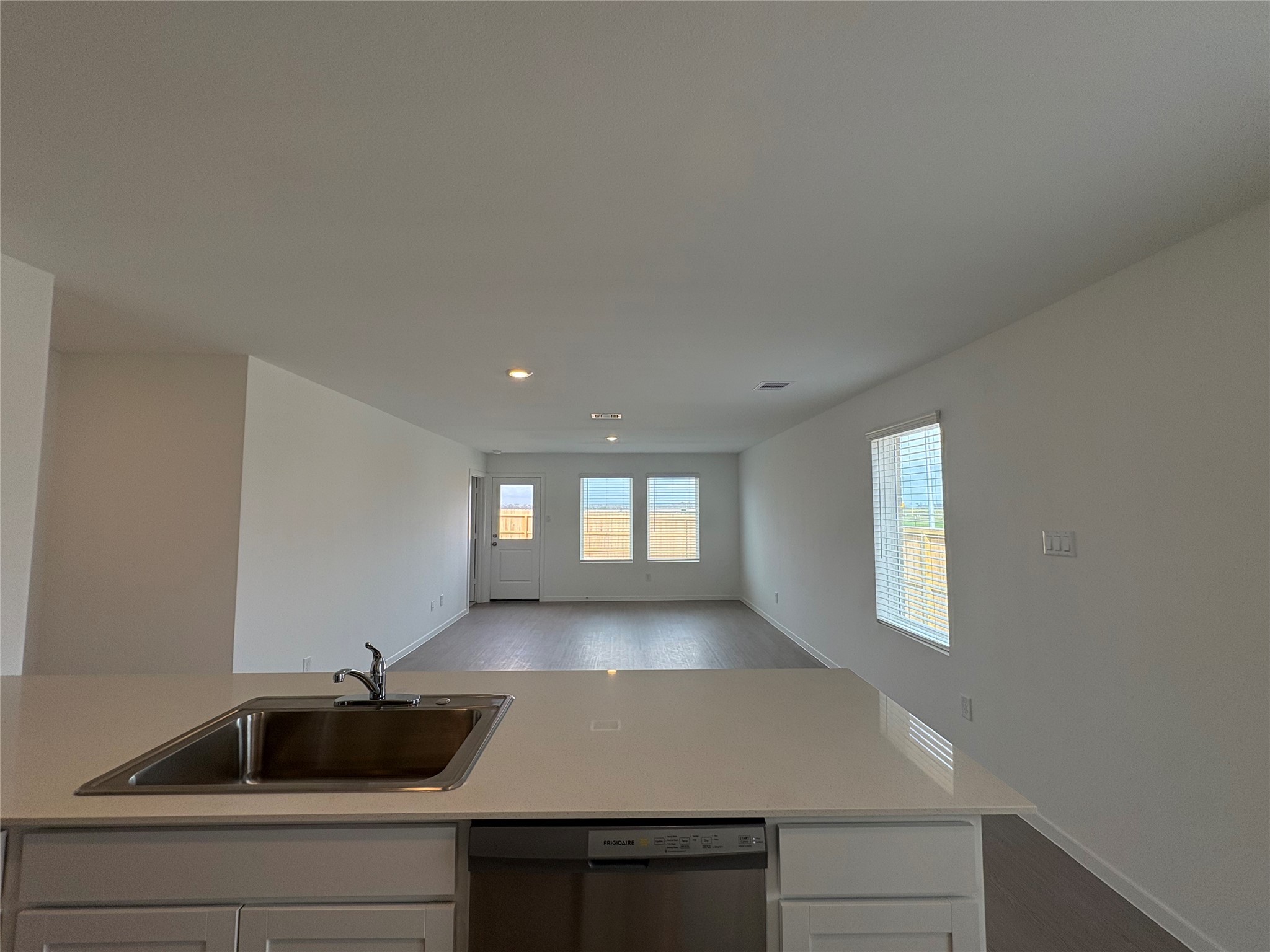 5727 Little Redwing Drive Baytown, TX 77521 - Photo 11 of 25 a view of a kitchen cabinets a sink and dishwasher in a room