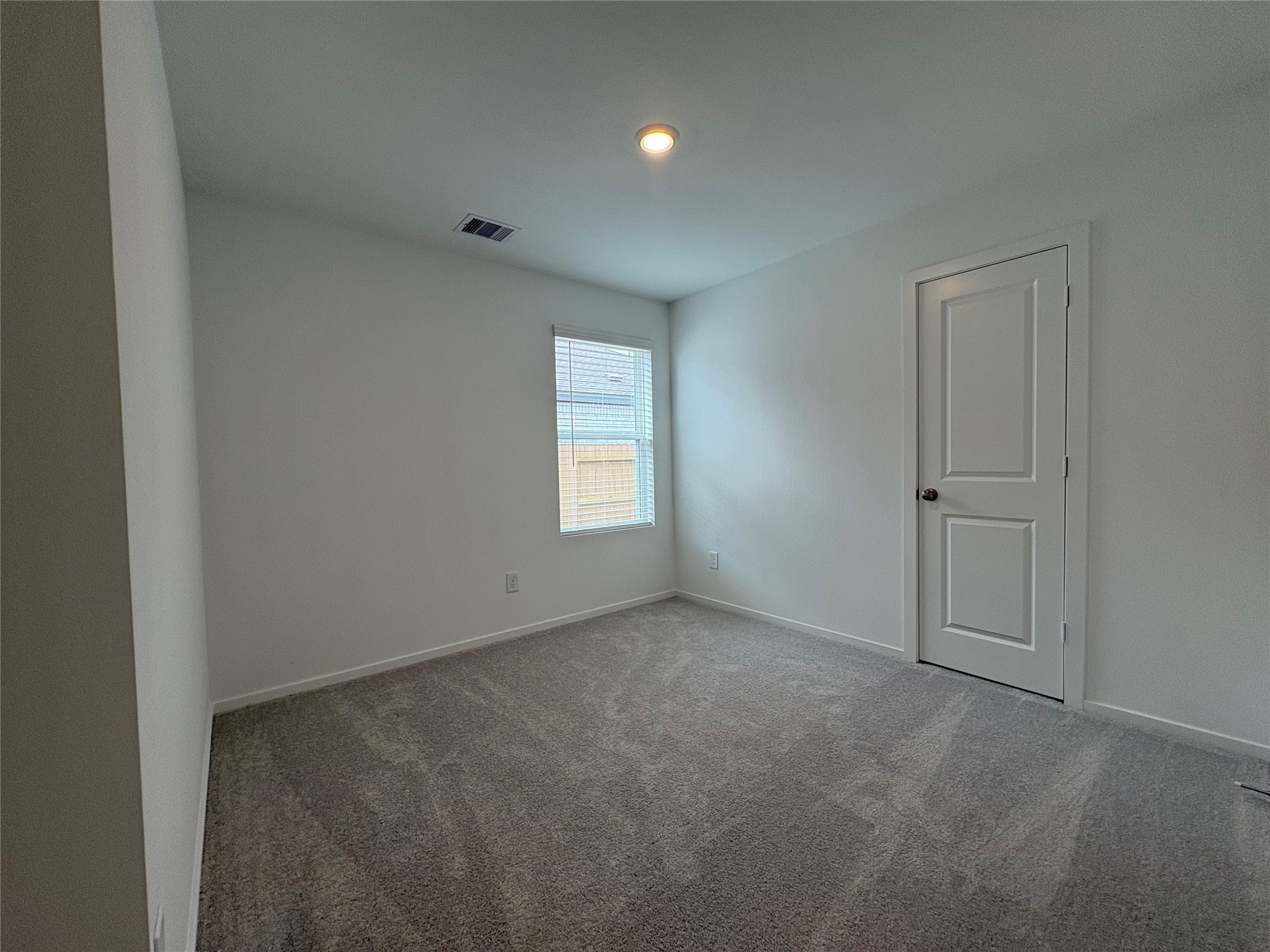 5727 Little Redwing Drive Baytown, TX 77521 - Photo 20 of 25 an empty room with windows