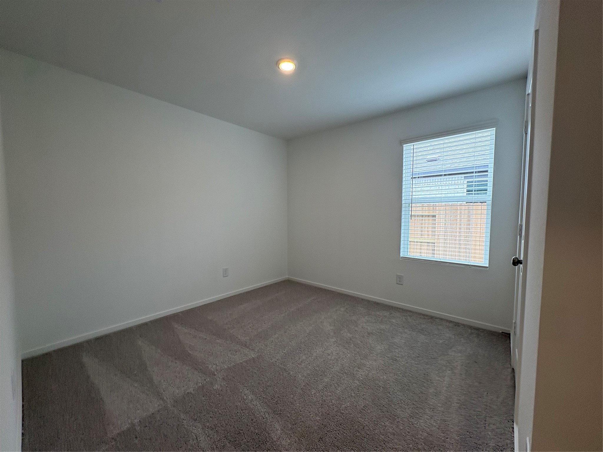 5727 Little Redwing Drive Baytown, TX 77521 - Photo 21 of 25 an empty room with a window