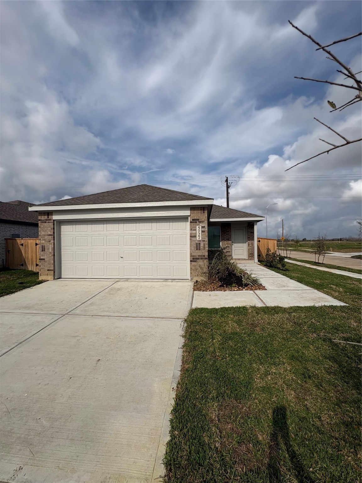 5727 Little Redwing Drive Baytown, TX 77521 - Photo 24 of 25 a front view of a house with a yard