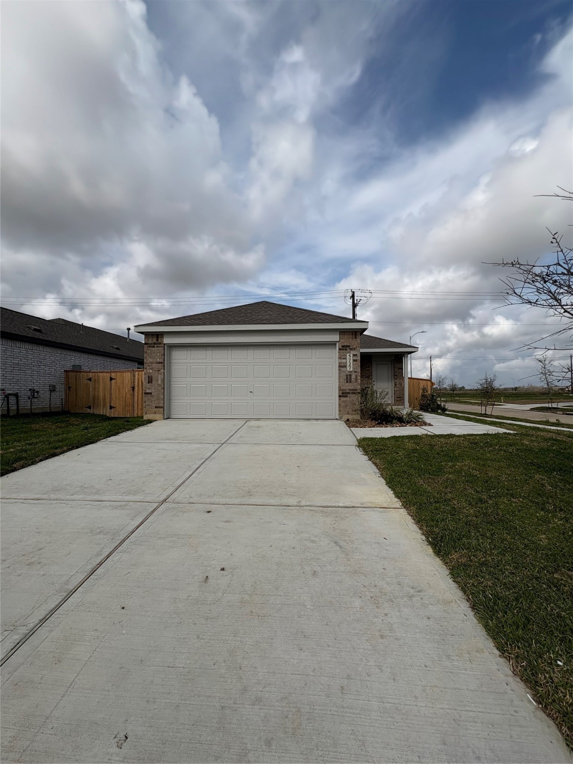 5727 Little Redwing Drive Baytown, TX 77521 - Photo 25 of 25 a front view of a house with a yard