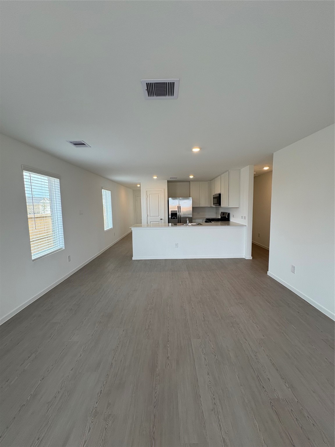 5727 Little Redwing Drive Baytown, TX 77521 - Photo 9 of 25 a view of a kitchen with a sink and cabinets