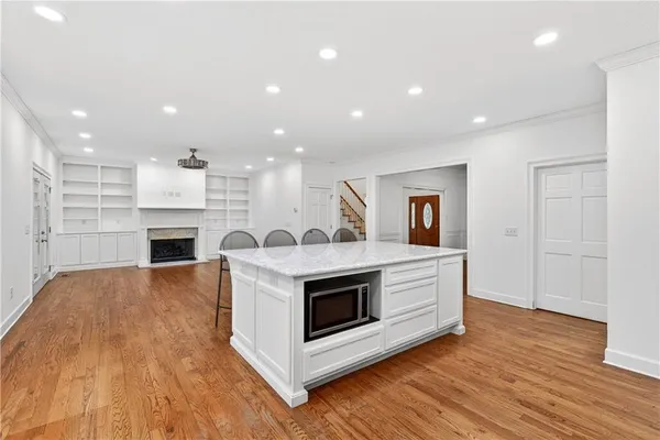 a view of kitchen with furniture and wooden floor