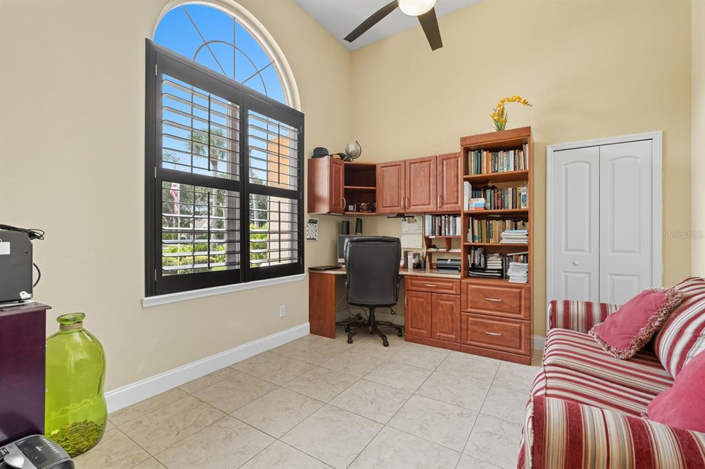 430 Lambert Avenue Flagler Beach, FL 32136 - Photo 13 of 63 a view of a livingroom with workspace and a window
