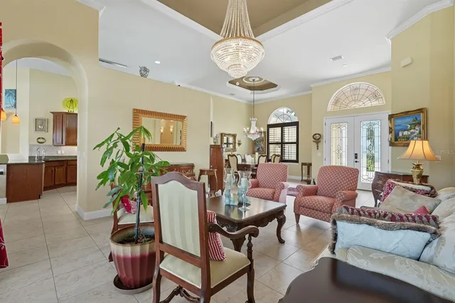 a kitchen with stainless steel appliances granite countertop a refrigerator a oven and a sink