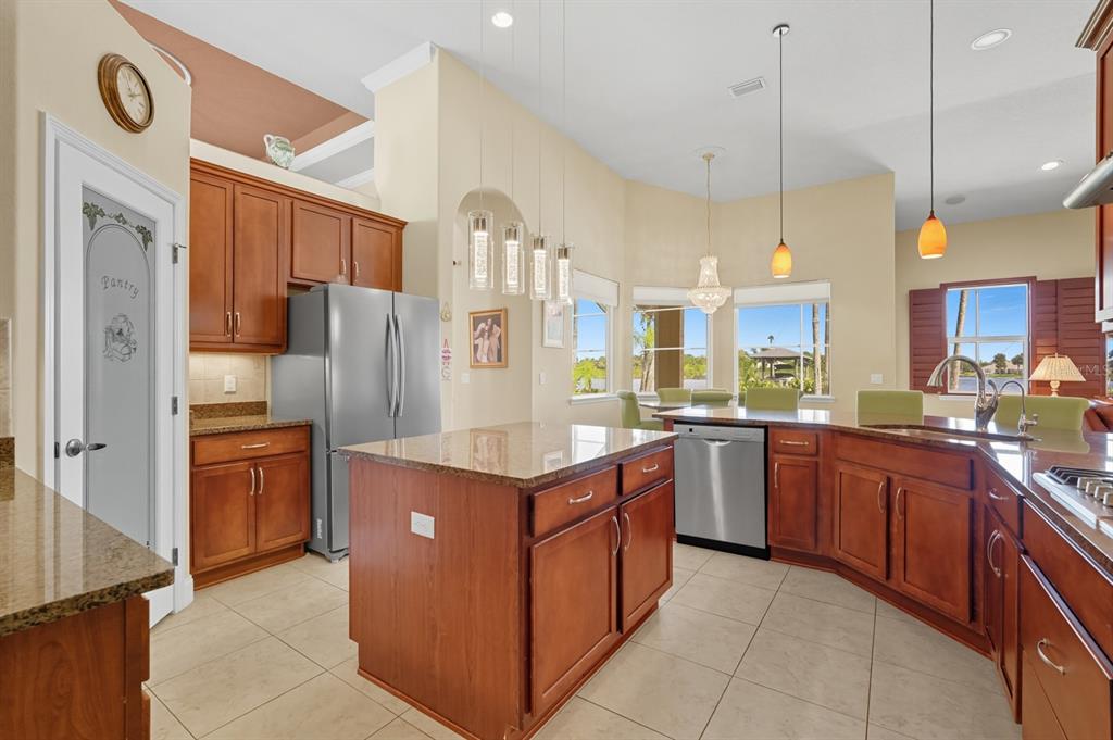 430 Lambert Avenue Flagler Beach, FL 32136 - Photo 21 of 63 a kitchen with stainless steel appliances granite countertop a refrigerator a oven and a sink