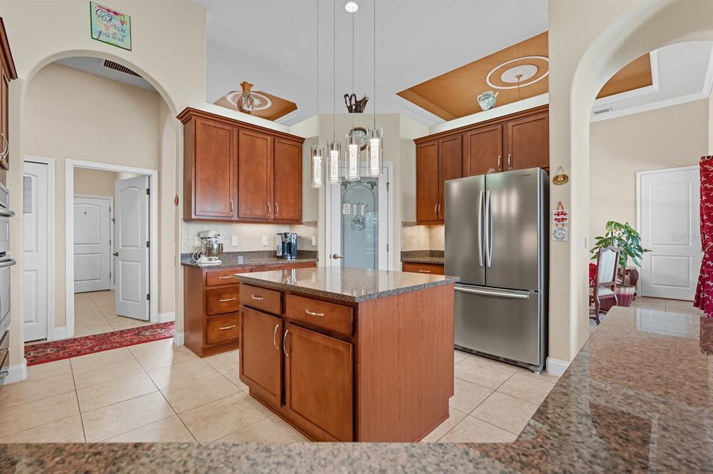 430 Lambert Avenue Flagler Beach, FL 32136 - Photo 22 of 63 a kitchen with stainless steel appliances granite countertop a refrigerator and a sink