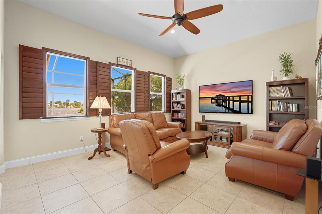 430 Lambert Avenue Flagler Beach, FL 32136 - Photo 26 of 63 a living room with furniture and a flat screen tv