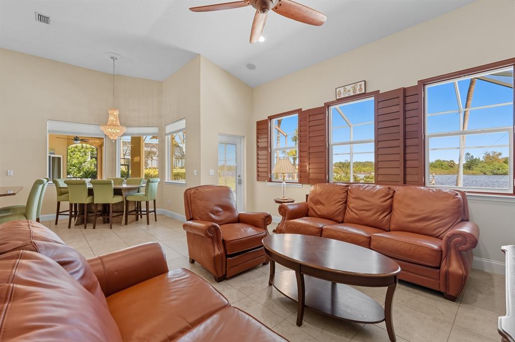 430 Lambert Avenue Flagler Beach, FL 32136 - Photo 29 of 63 a living room with furniture and a large window