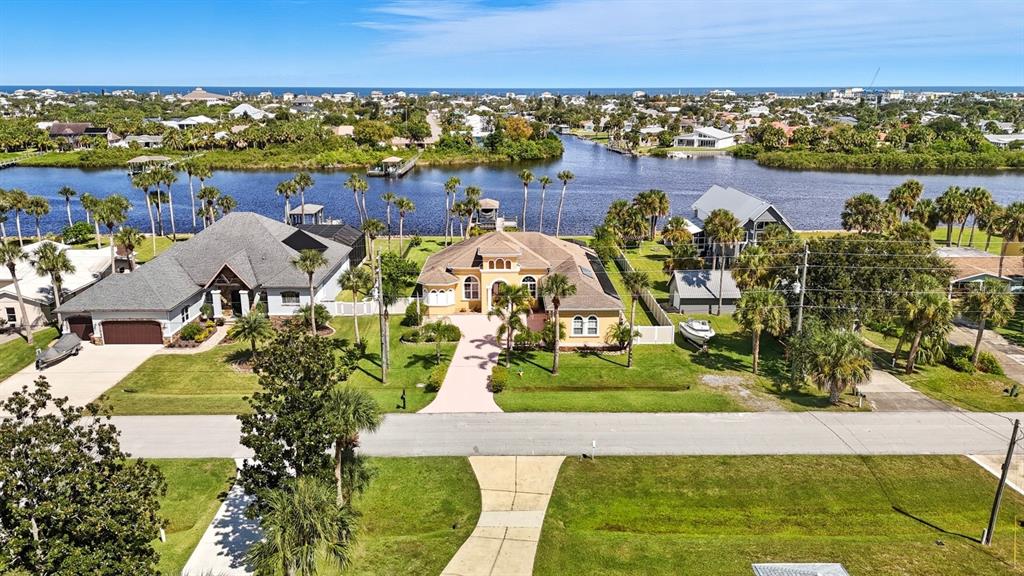 430 Lambert Avenue Flagler Beach, FL 32136 - Photo 4 of 63 an aerial view of a house with a garden