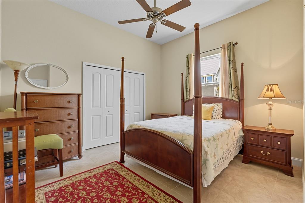 430 Lambert Avenue Flagler Beach, FL 32136 - Photo 42 of 63 a bedroom with a bed a dresser and chair