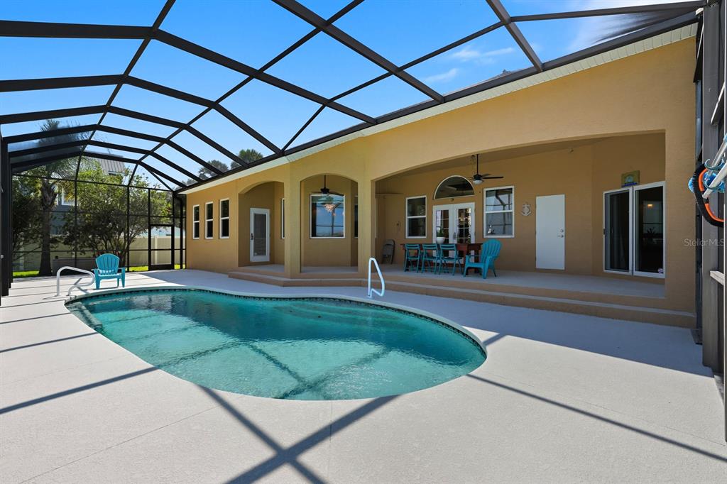 430 Lambert Avenue Flagler Beach, FL 32136 - Photo 45 of 63 a view of a porch with furniture and a patio