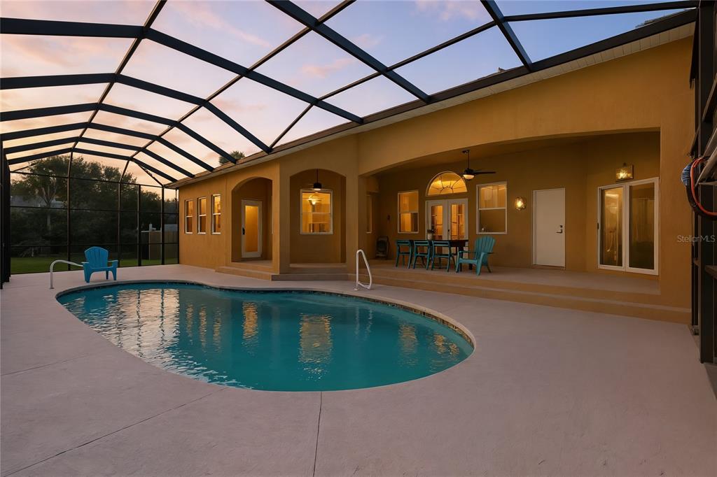 430 Lambert Avenue Flagler Beach, FL 32136 - Photo 46 of 63 a view of a swimming pool with a patio