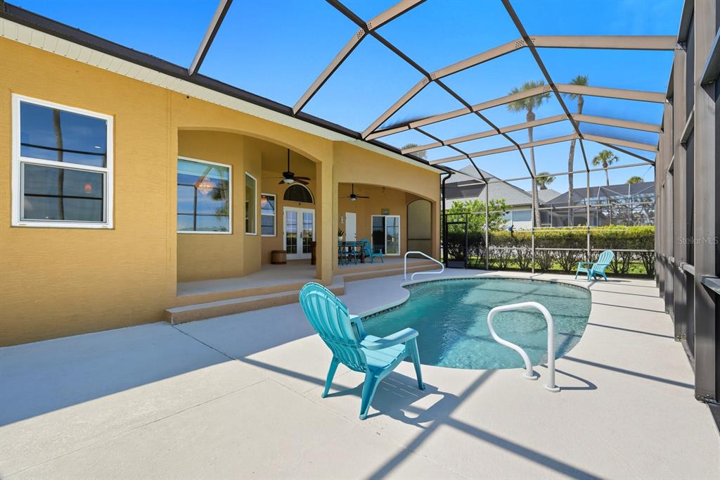 430 Lambert Avenue Flagler Beach, FL 32136 - Photo 50 of 63 a view of a patio with a table and chairs