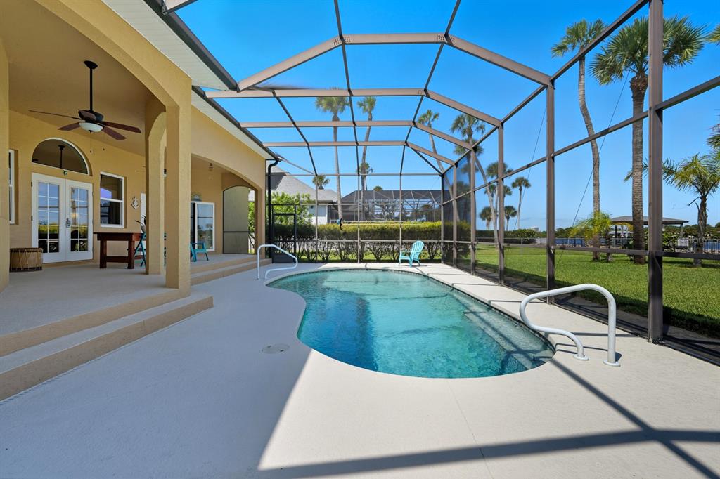 430 Lambert Avenue Flagler Beach, FL 32136 - Photo 51 of 63 a view of a swimming pool with a patio
