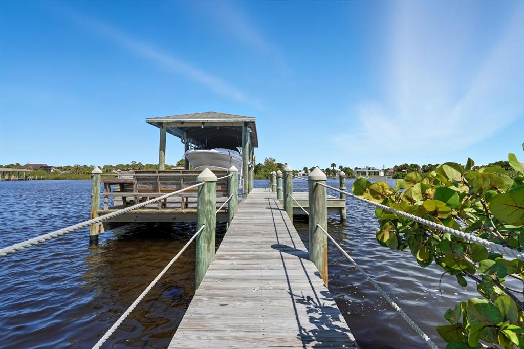 430 Lambert Avenue Flagler Beach, FL 32136 - Photo 60 of 63 a view of a balcony with wooden floor and city view